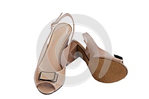 Beige feminine shoes with open toe and bow, isolated