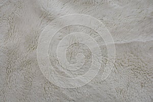 Beige fuzzy soft fleecy nap texture. Natural background