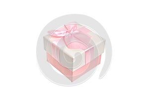Beige gift box with a delicate pink engagement bow. Present for a birthday holiday, a Christmas event and a romantic greeting.