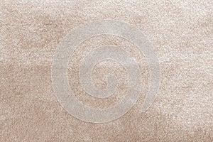 Beige gold velvet background or velour flannel texture made of cotton or wool with soft fluffy velvety satin fabric photo