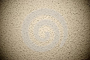 Beige grained wall background or texture
