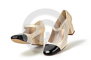 Beige high heel shoes with black tip