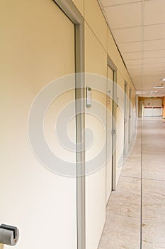 Beige hospital hallway; empty hospital corridor; hospital interi