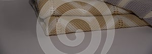 Beige knitted blanked with white stripes.flat lay