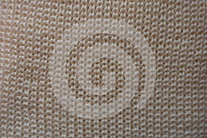Beige knitted fabric from above ribbing pattern