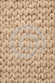 Beige knitted fabric texture background