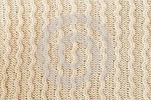 Beige knitting wool texture background.