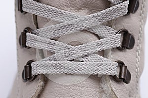 Beige leather boot with laces up closeup