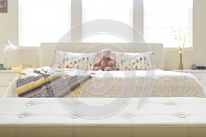 Beige leather empty bench in bedroom