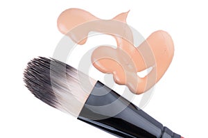 Beige liquid foundation makeup with brush