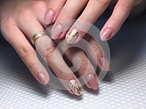 Beige manicure with gold foil design