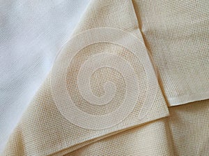 Beige and milk white folded canvas. Fabric texture background