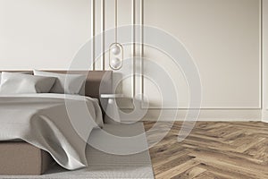 Beige modern bedroom interior with bed, molding wall and hardwood floor