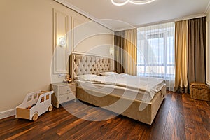 Beige modern bedroom interior with double bed