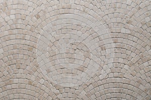 Beige mosaic tile texture on the bathroom wall