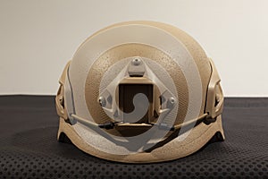 Beige nato military helmet on white background