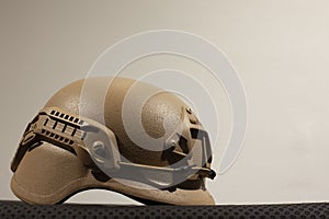 Beige nato military helmet on white background