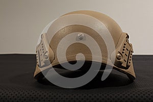 Beige nato military helmet on white background