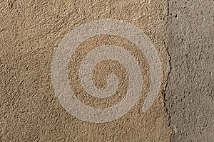 Beige painted stucco wall. Background texture