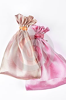 Beige and pink jewelry bags.