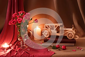 Beige pink still life with roses, candles and vintage car