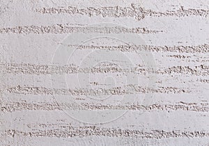 Beige plaster textured background. Abstact beige stucco. Texture of plaster on the wall.