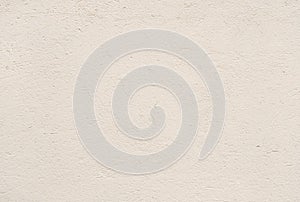 Beige plastered wall texture background