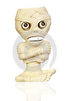 Beige plastic toy as a mummy