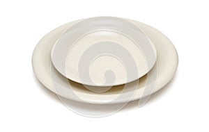 Beige plate and saucer isolated