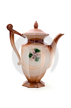 Beige porcelain teapot with ornament flowers.