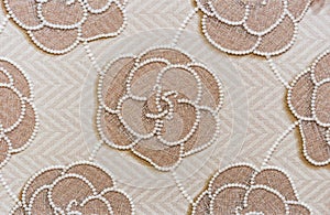 Beige porcelan stoneware tile with floral pattern. Background of porcelain stonewear tiles