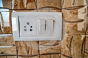 Beige rocker light switch with two buttons
