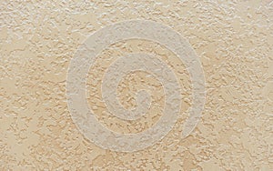 Beige seamless venetian stucco. Background and texture of decorative plaster