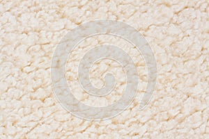 Beige sherpa plush material background