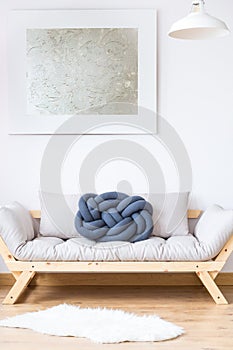 Beige sofa with blue pillow