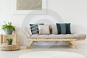 Beige sofa with blue pillows