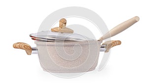 Beige spotted kitchen pan and knife side view isolated with clipping path
