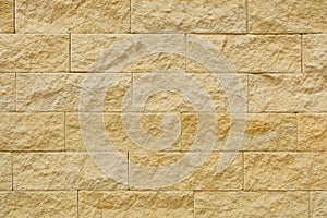 Beige stone blocks in the wall