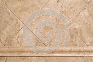 Beige Stone Tiles on Bathroom Wall