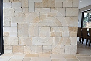 Beige stone wall with textured surface pattern. AI generative