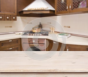 Beige table on defocused brown kitchen interior background