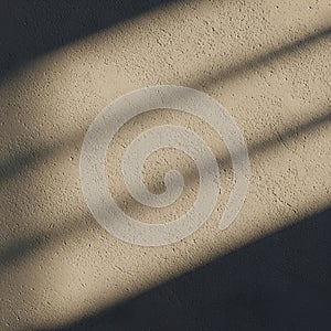 Beige textured wall with diagonal, soft shadows, creating a pattern across the