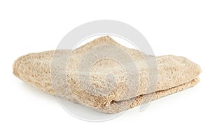 Beige towel isolated on a white