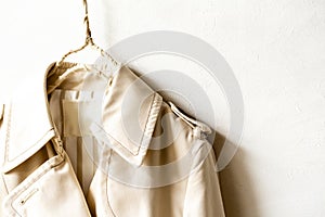 A beige trench coat isolated over white
