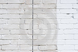 Beige and white brick wall with black line detail texture background. Old, painted, weathered and cracked bricks with concrete