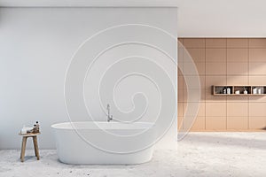 Beige and white tile bathroom with bathtub