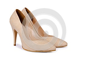 Beige woman shoes on a white photo