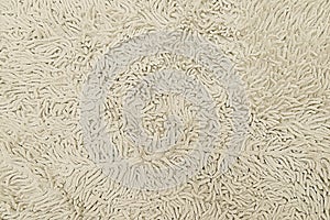 Beige woolen carpet texture background