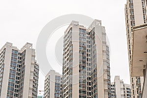 Beihai, China - July 18, 2019: Modern Chinese Apartment Building With Balconies in Residential Area