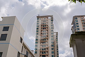 Beihai, China - July 24, 2019: Modern Chinese Apartment Building With Balconies in Residential Area